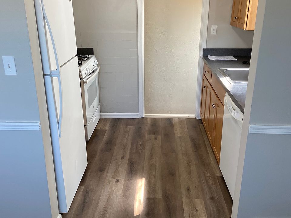 View of kitchen from small eating area (new vinyl plank flooring)