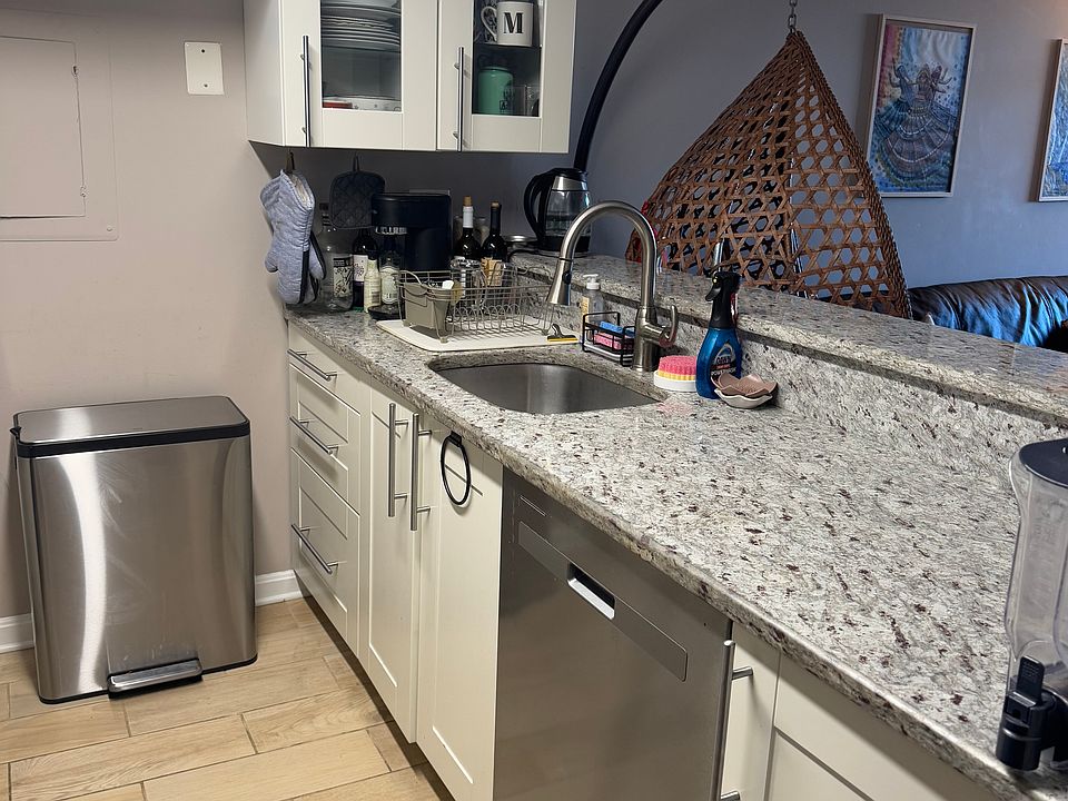 Kitchen facing the living room/dining room. Has a little bar counter.