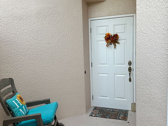Gated front entrance vestibule fits additional seating, plants, or bicycles.