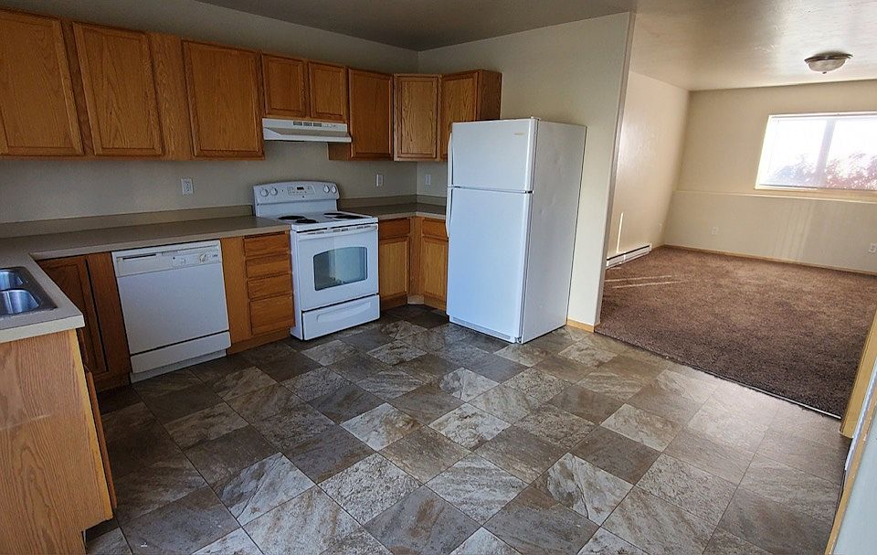 Kitchen with living room in the background
