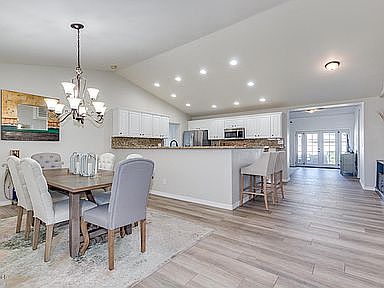 Vaulted open-concept kitchen and dining area _ ideal for entertaining