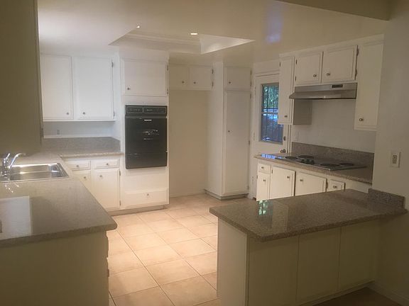 Kitchen- New Granite Countertops and Refinished Cabinets