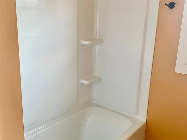 Bathroom with bathtub and shower