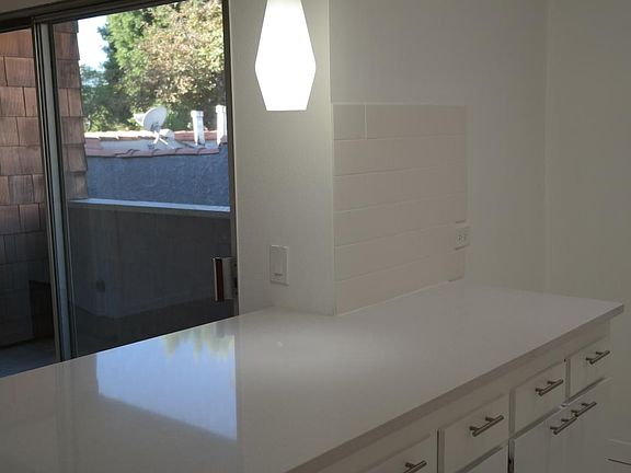 Kitchen with views of balcony