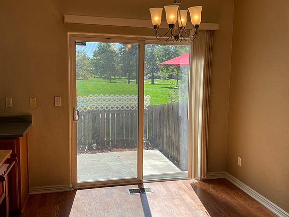 View of back patio overlooking park from the dining area