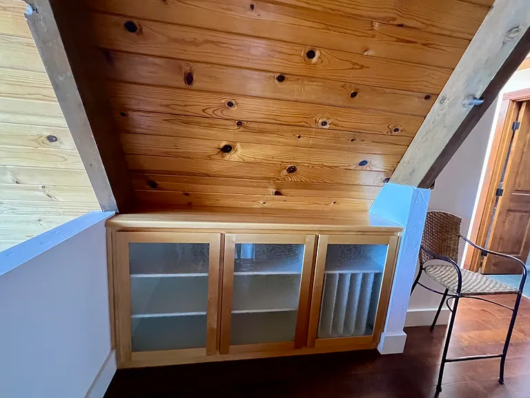 Built ins in the loft at the top of the staircase