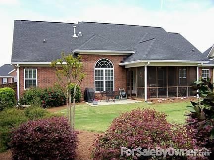 Rear of House
						:
						Fenced porch built original to home.