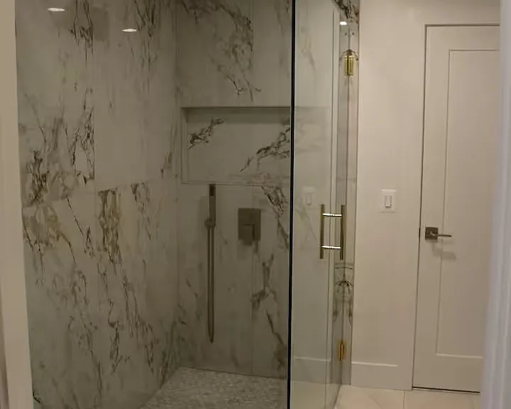 Shower with rainfall showerhead and heated floors.