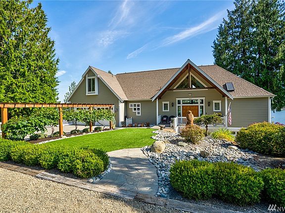 Extra parking, beautiful Flag stone entry and pathway with beautifully landscaped low maintenance yard.