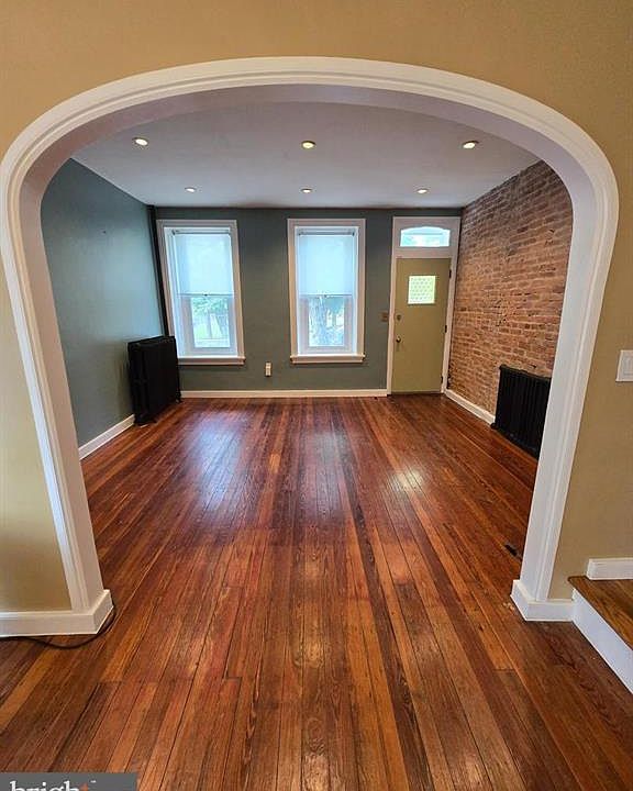 Living room with exposed brick.