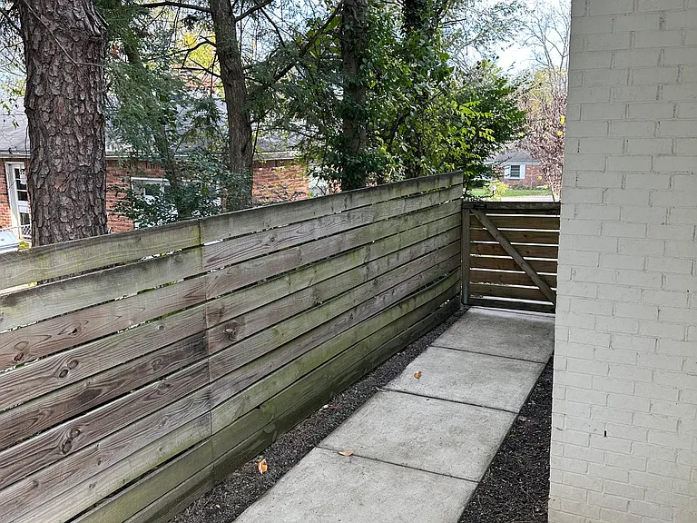 Backyard entry from the driveway and road.