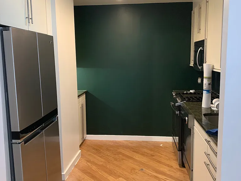 photo provided for view of 4 door refrigerator. (flooring has since been replaced since this photo was taken.)