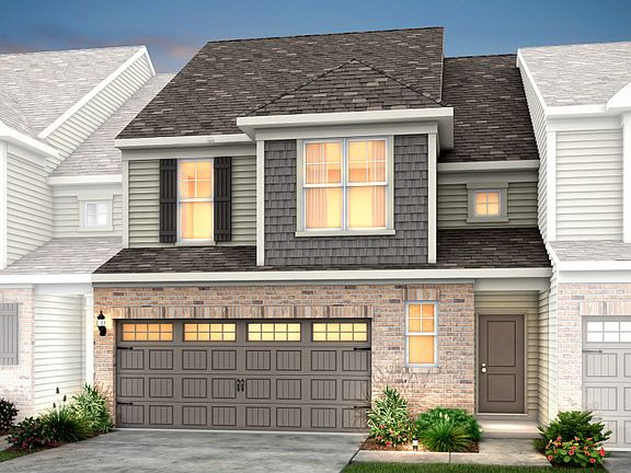 Palomino Exterior 9 features siding, shakes, brick, covered front door and 2 car front load garage