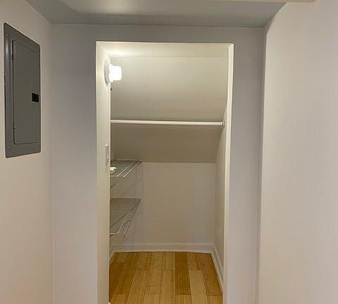 Closet with two shelves and rod for hanging clothes
