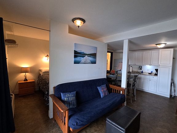 queen bedroom, futon in living area and kitchen