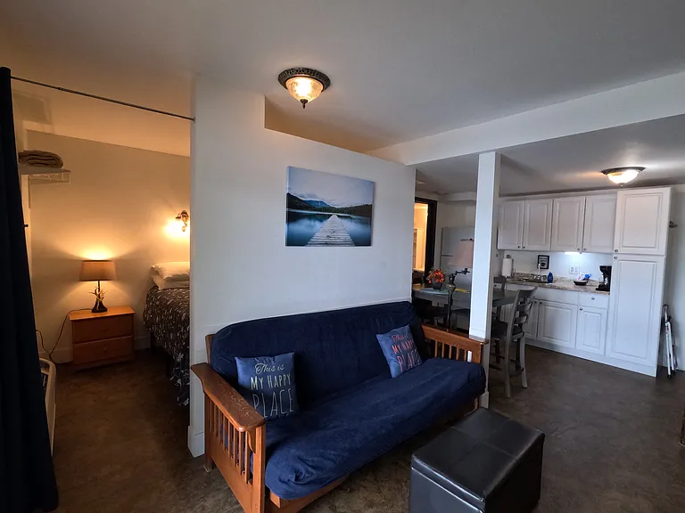 queen bedroom, futon in living area and kitchen