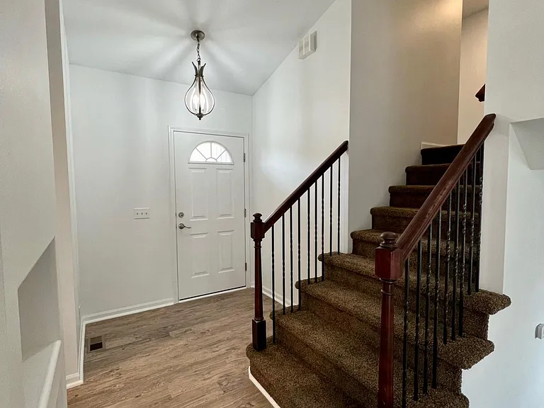 Front door and stairs to bedrooms