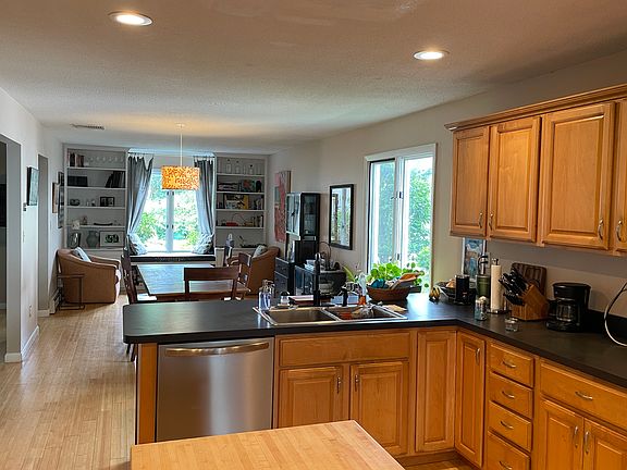 Kitchen and open floor plan living and dining area