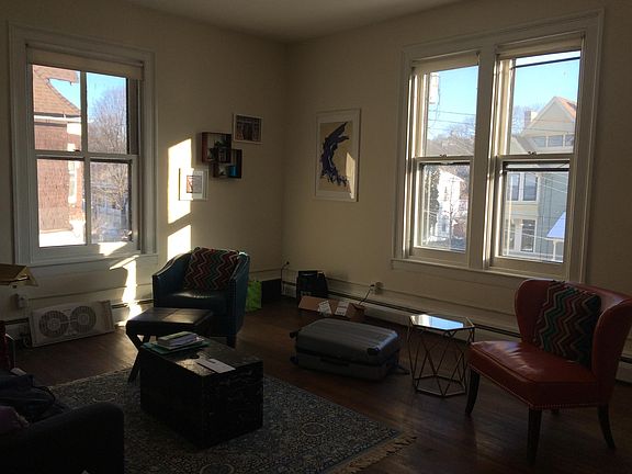 Oversized windows and high ceilings in living room