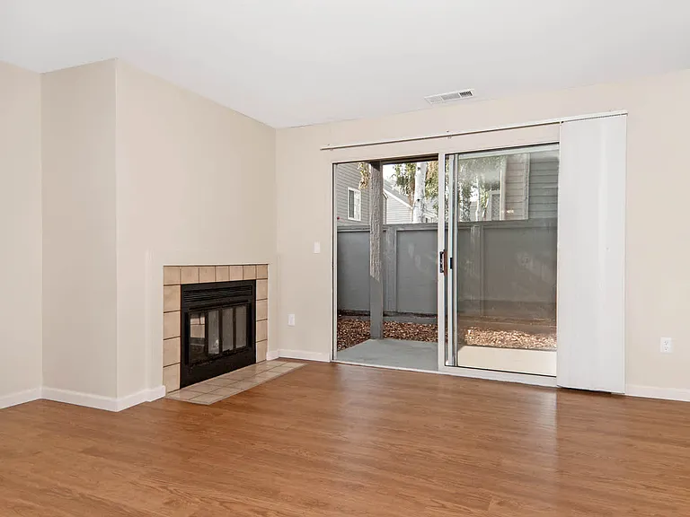 Living Room with Hard Surface Flooring, Fireplace and Patio