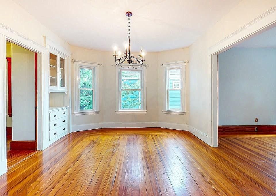 Dining room. Door to second floor bedroom is on left; doorway to living room is on right.