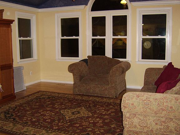 Sunroom addition, hardwood floors, vautled ceiling, backs to woods