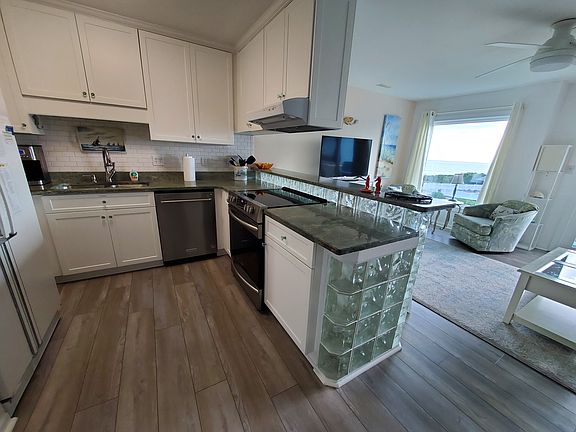 Kitchen opens to family bar and includes a snack bar