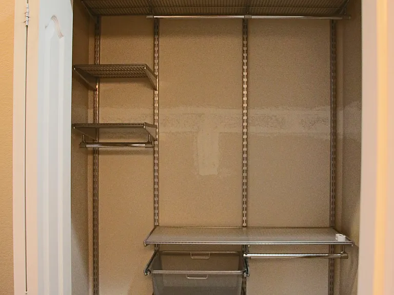 Coat closet near garage and laundry