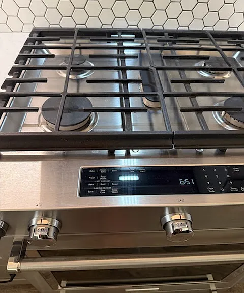 Oven is electric for even cooking. Top is powered by propane gas. Perfect for gourmet cooks!