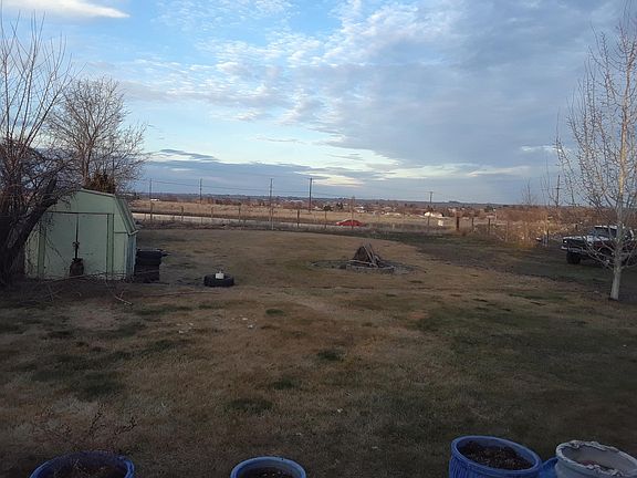 Back yard, metal garden shed (patio and deck space out of fr
