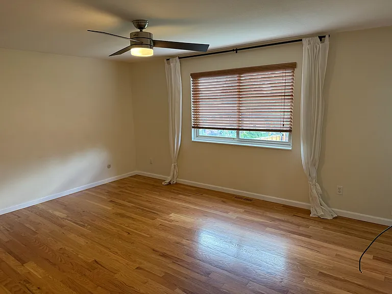 primary bedroom with large window for natural light