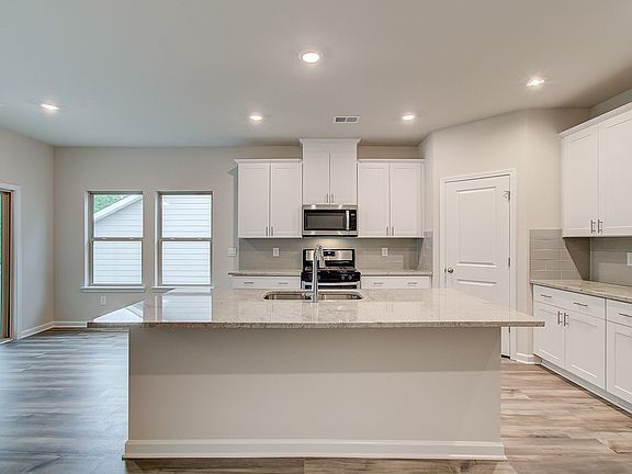 Spacious kitchen island perfect for entertaining.