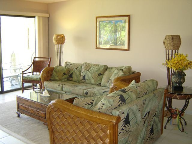Livign room opens to lanai and pool