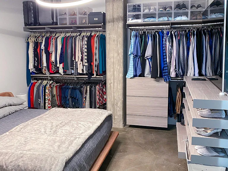 Bedroom with king size bed and custom closets.