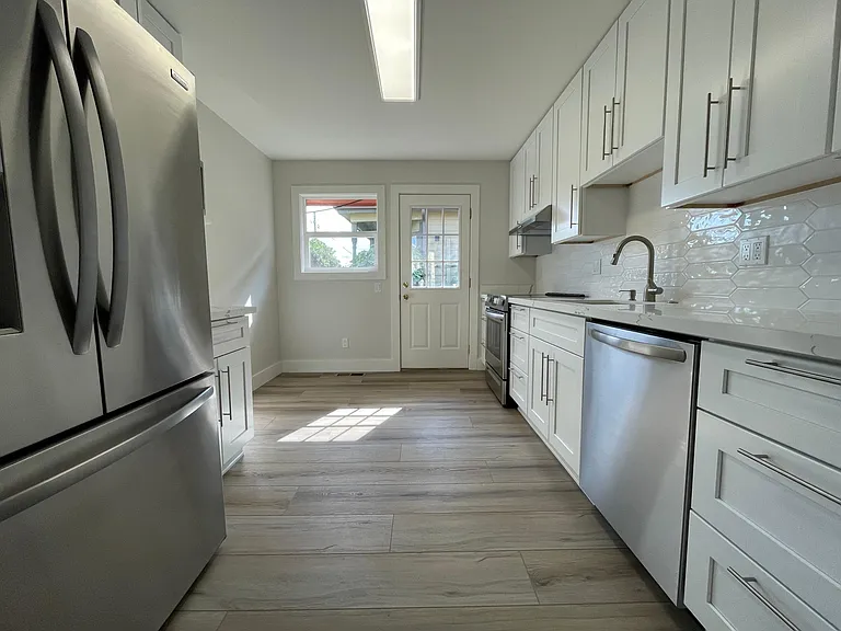 Unit 413 has refinished hardwood flooring rather than LVT like this unit 417