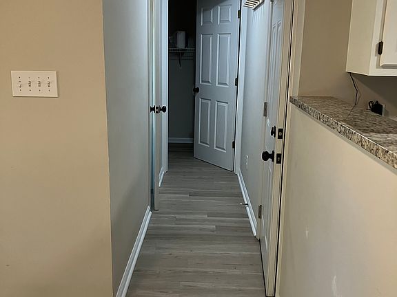 Hall leading to garage and laundry.