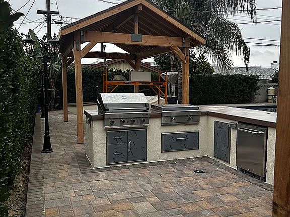Outdoor kitchen with patio