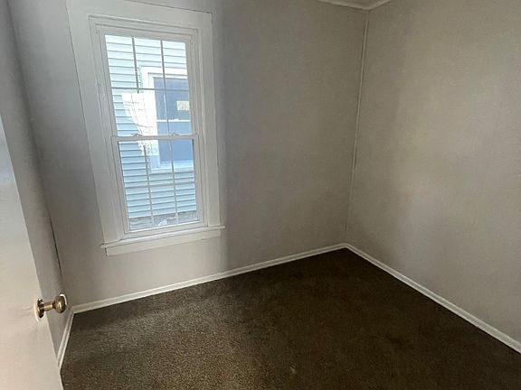 Small second bedroom (7 feet by 9 feet) . Suitable for small child or home office.