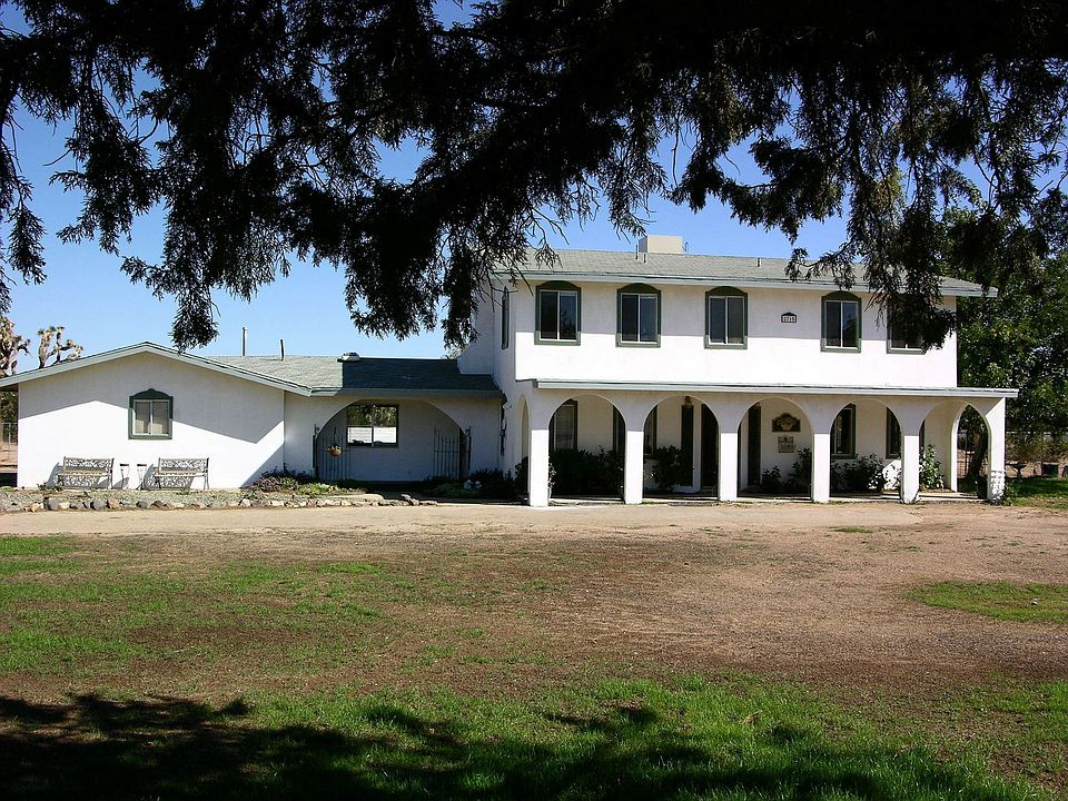 colonial style but can be updated w/stone on arches and upper balcony