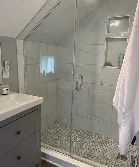 3rd-floor bathroom with frameless shower doors