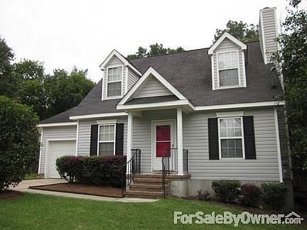 adorable home with landscaped yard