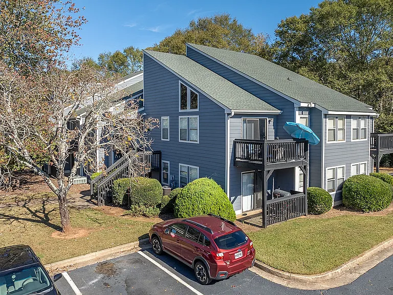 Experience cozy living with this charming apartment featuring outdoor balconies and serene surroundings.