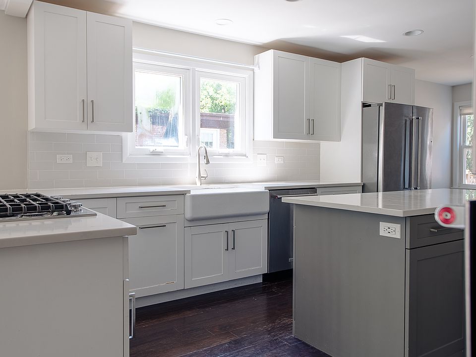 Beautifuly designed open-concept kitchen with brand new fridge.