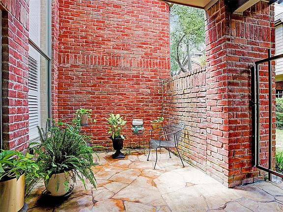 This cozy front patio/porch is inside the gate to the TH's front door (behind you) and offers a welcoming ambiance when you arri