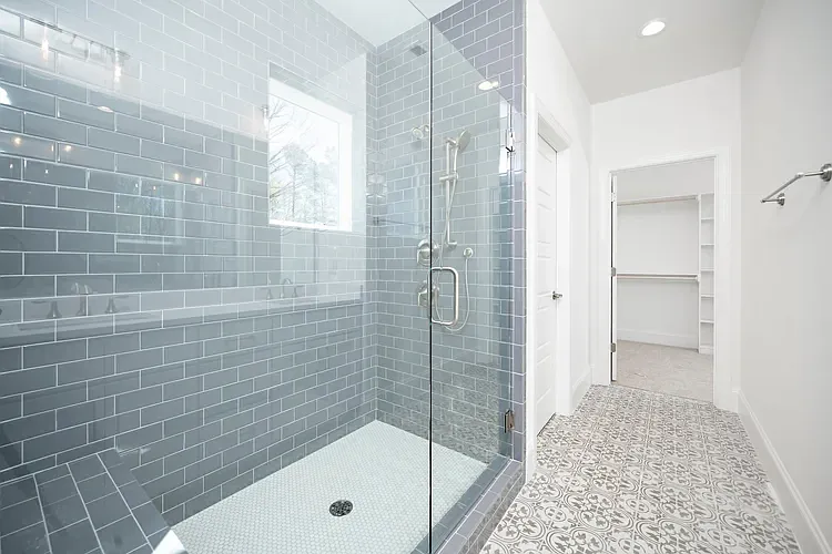 Modern finishes, floor to ceiling tiled shower