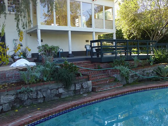 family room windows overlook pool & garden