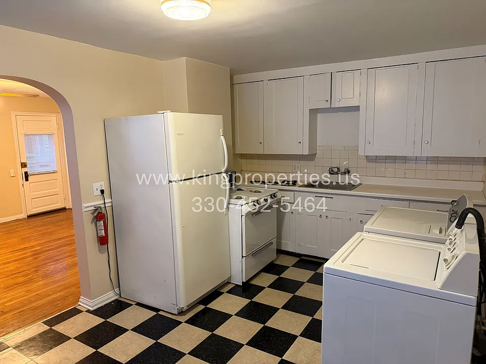 Kitchen. Has laundry hookups. Washer and dryer were left by old tenant.