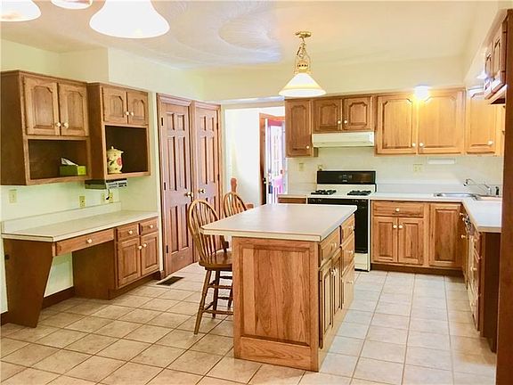You cant go wrong with the amount of storage you have in this kitchen! Double Pantry and pull out Storage in the island.