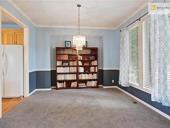 Dining room has new carpet and large windows