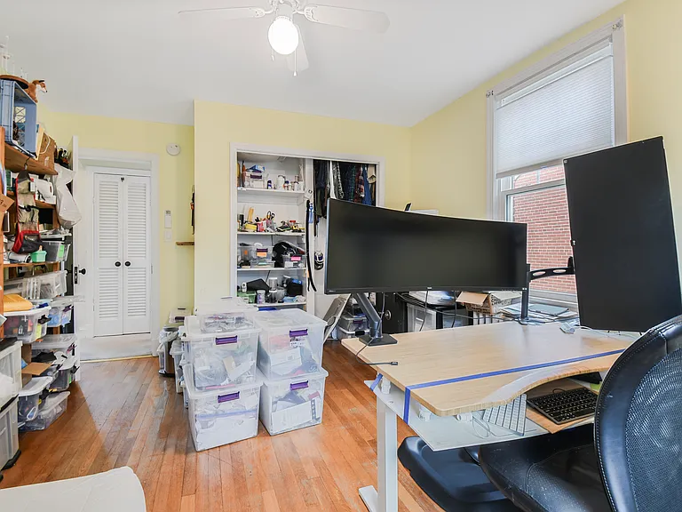 Northeast bedroom/office from north east corner. Hardwood floor.